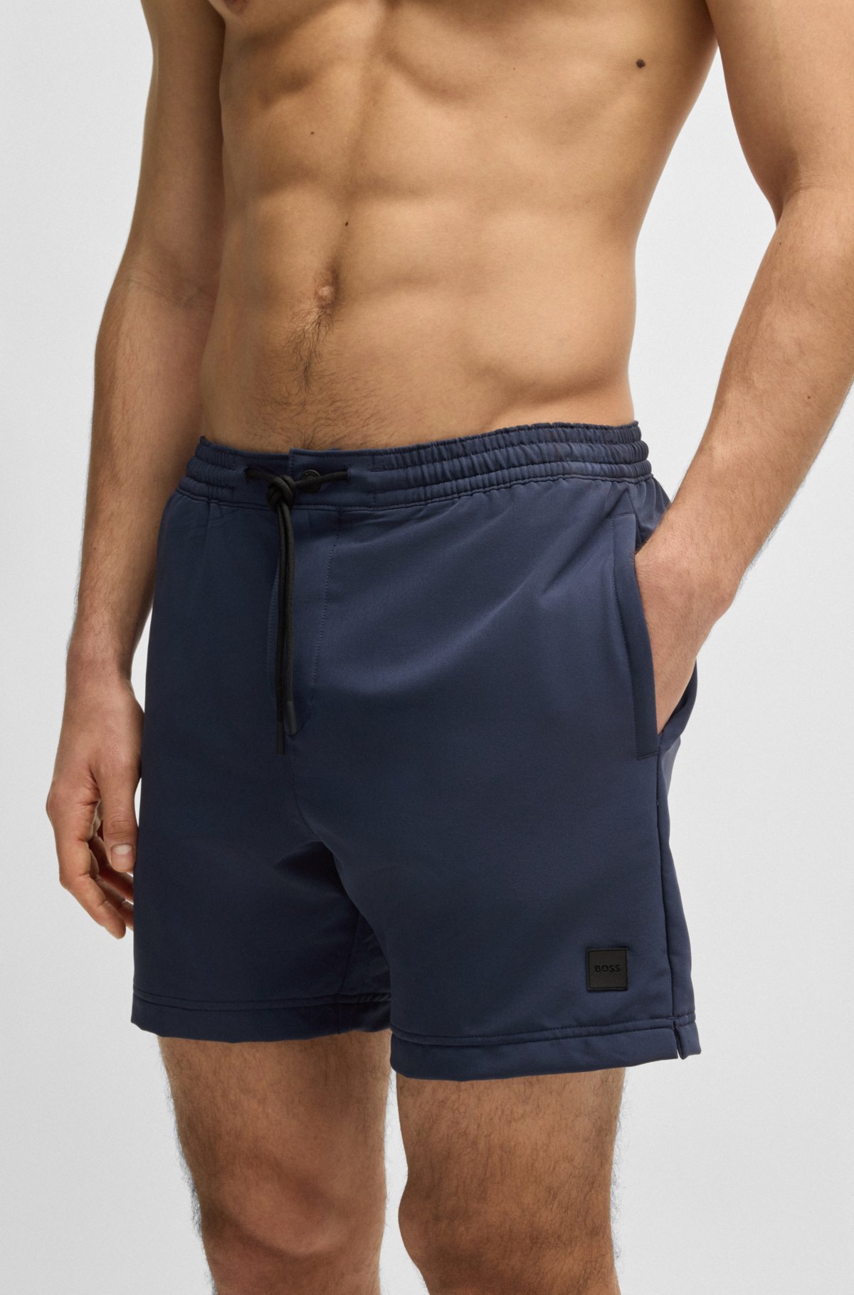 Pantalones cortos de baño con insignia de logo y construcción plegable