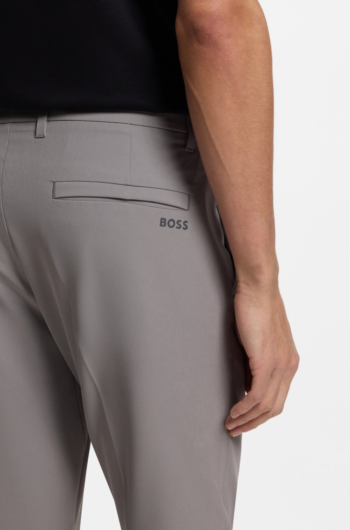 Pantalones ajustados en tejido elástico impermeable
