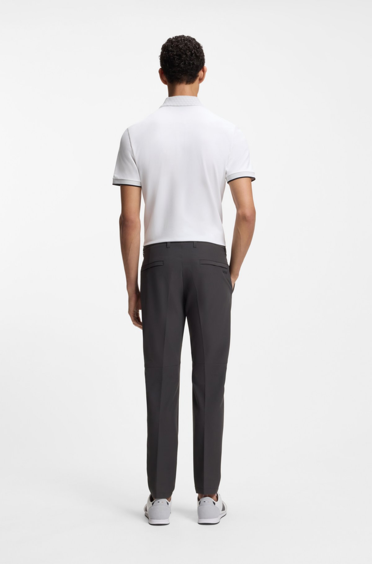 Pantalones ajustados de tela elástica impermeable