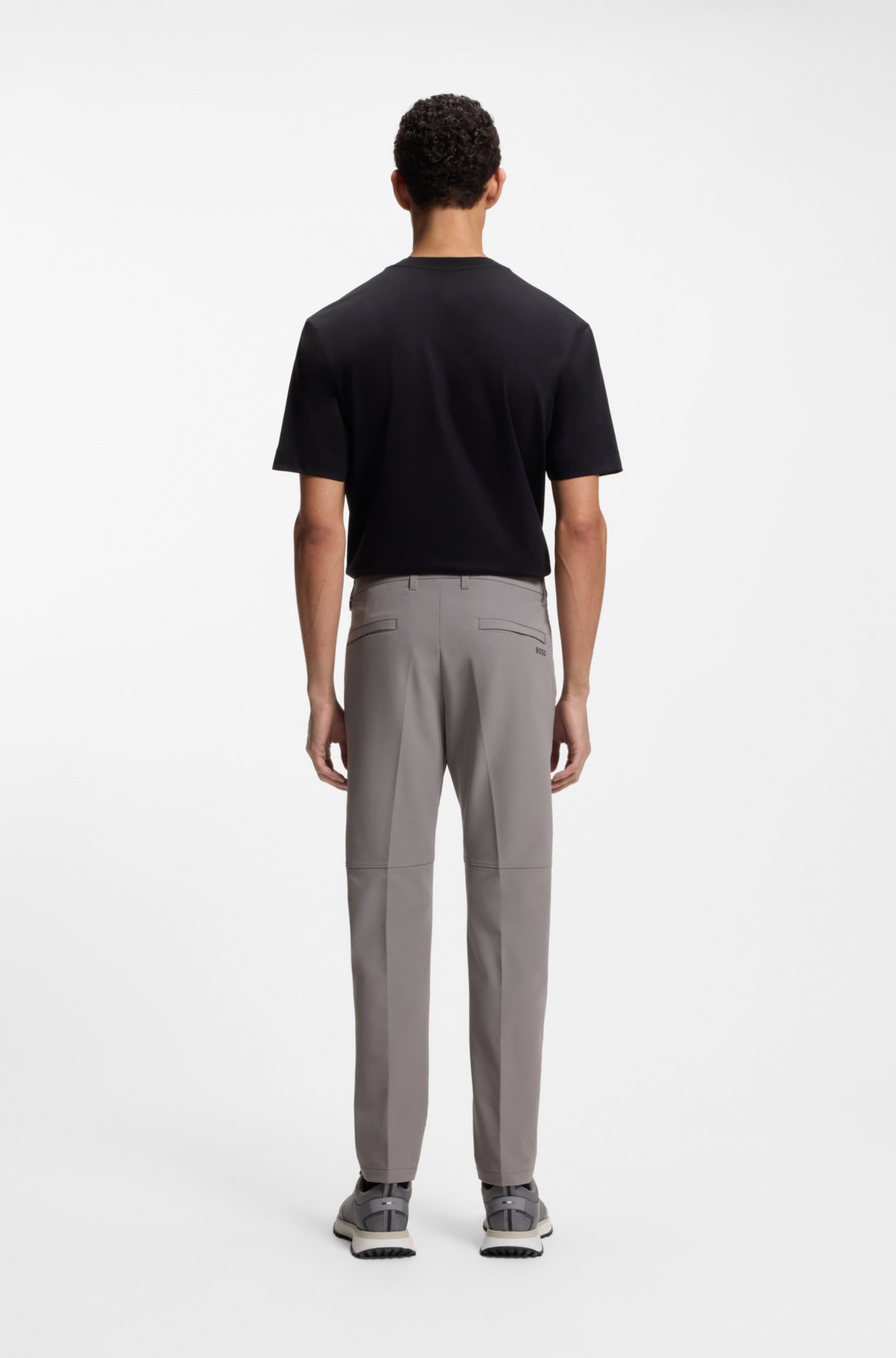 Pantalones ajustados en tejido elástico impermeable