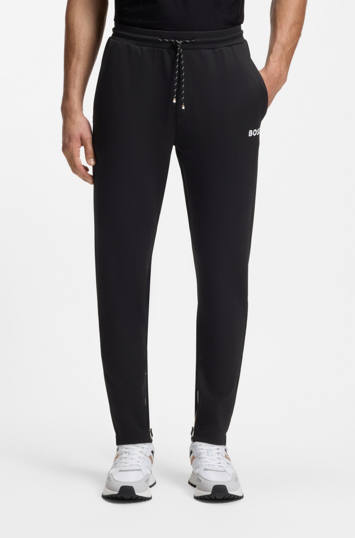 Pantalones de chándal de gabardina elástica activa con dobladillos con cremallera