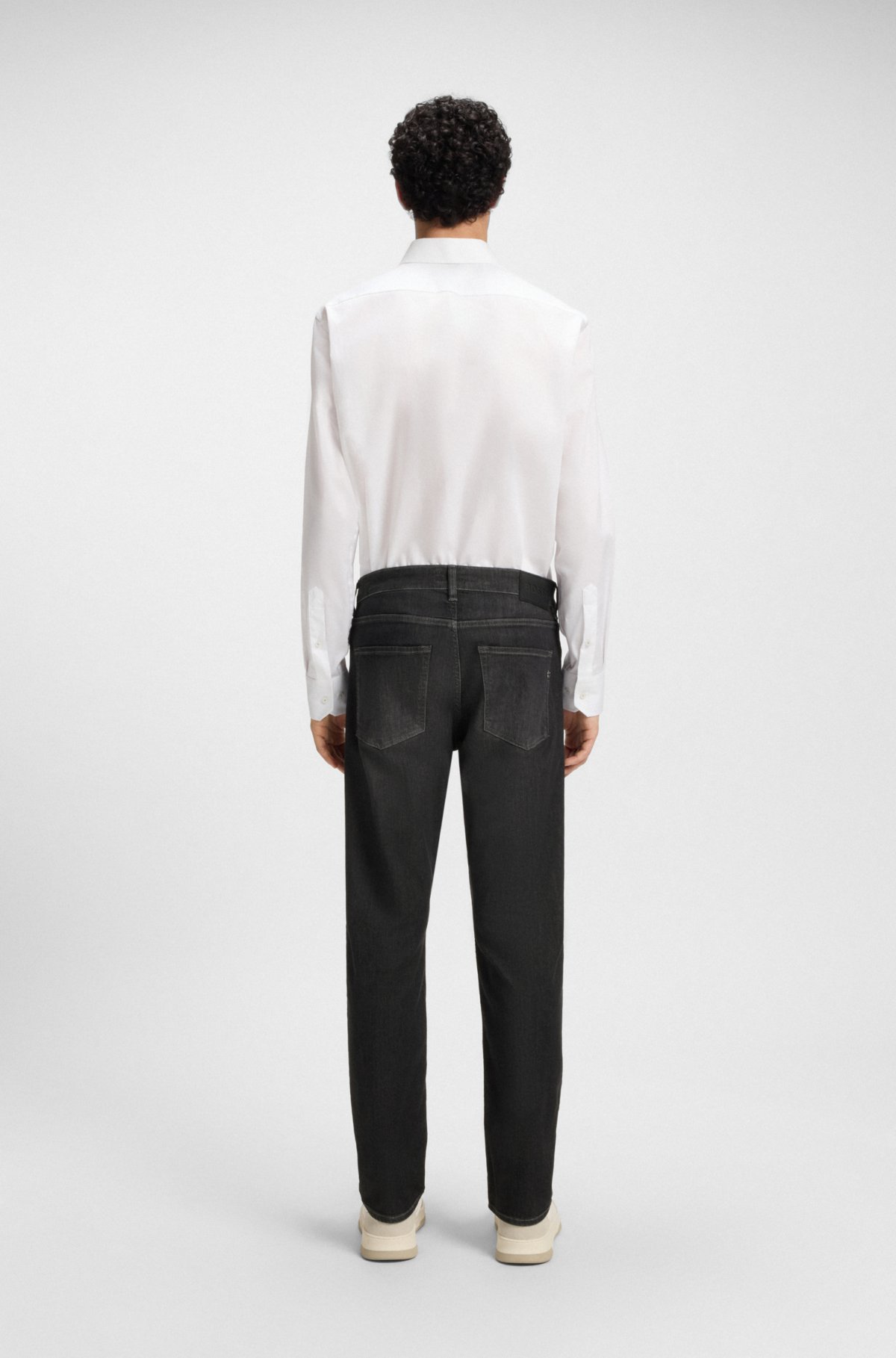 Pantalones vaqueros ajustados negros de Delaware en denim elástico
