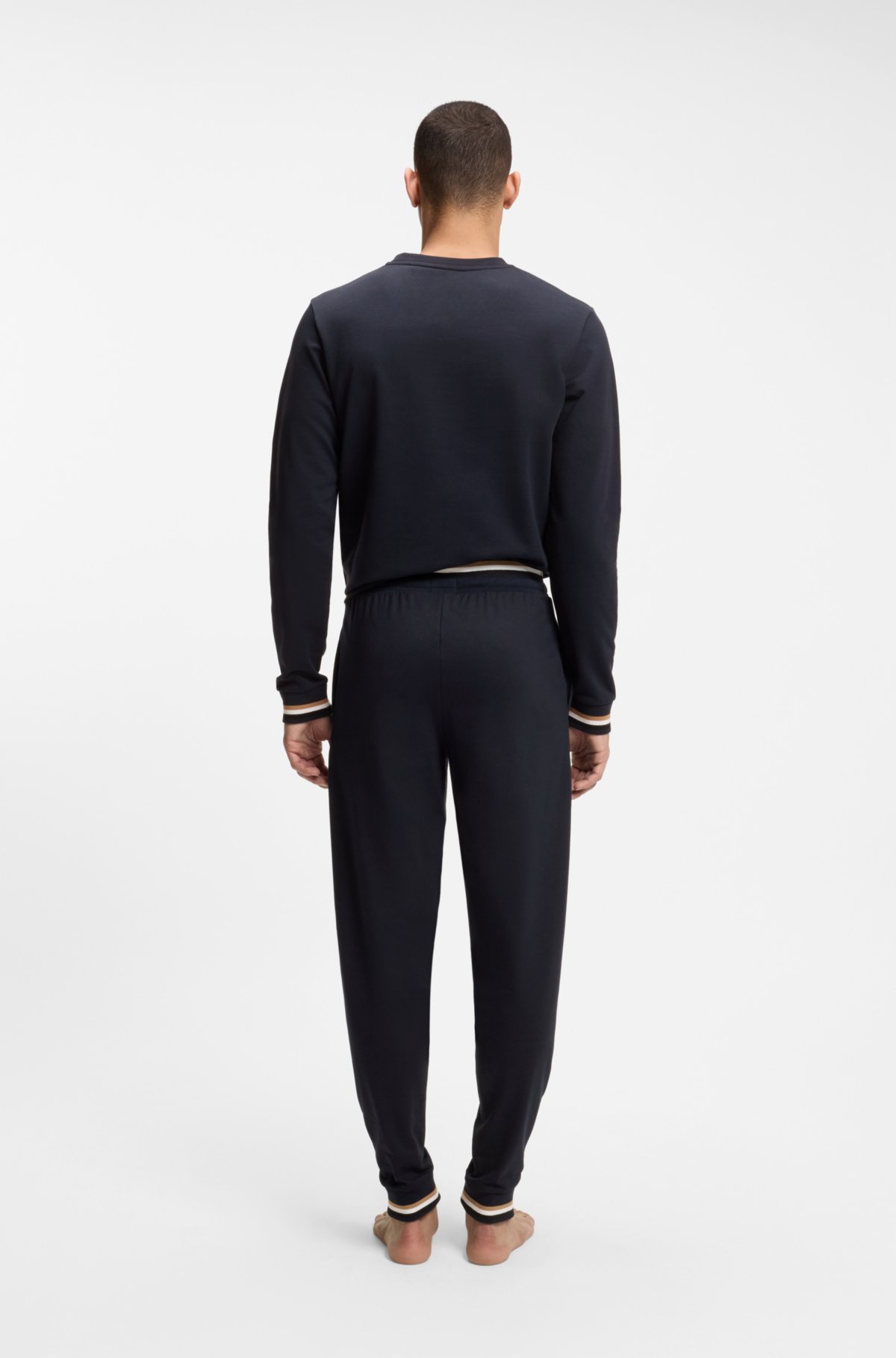 Pantalones de chándal de algodón-terciopelo con rayas características y logotipo