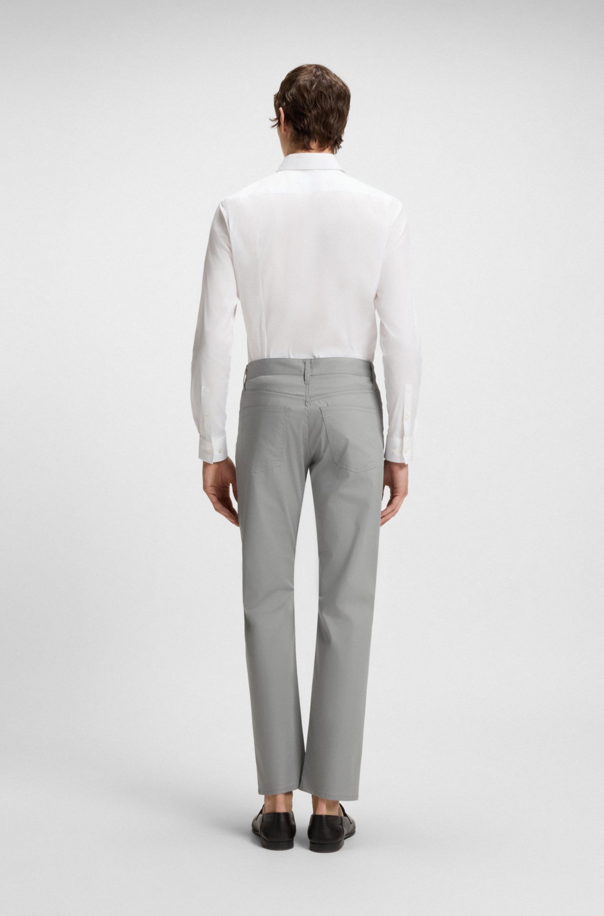 Pantalones ajustados de algodón, seda y elastano