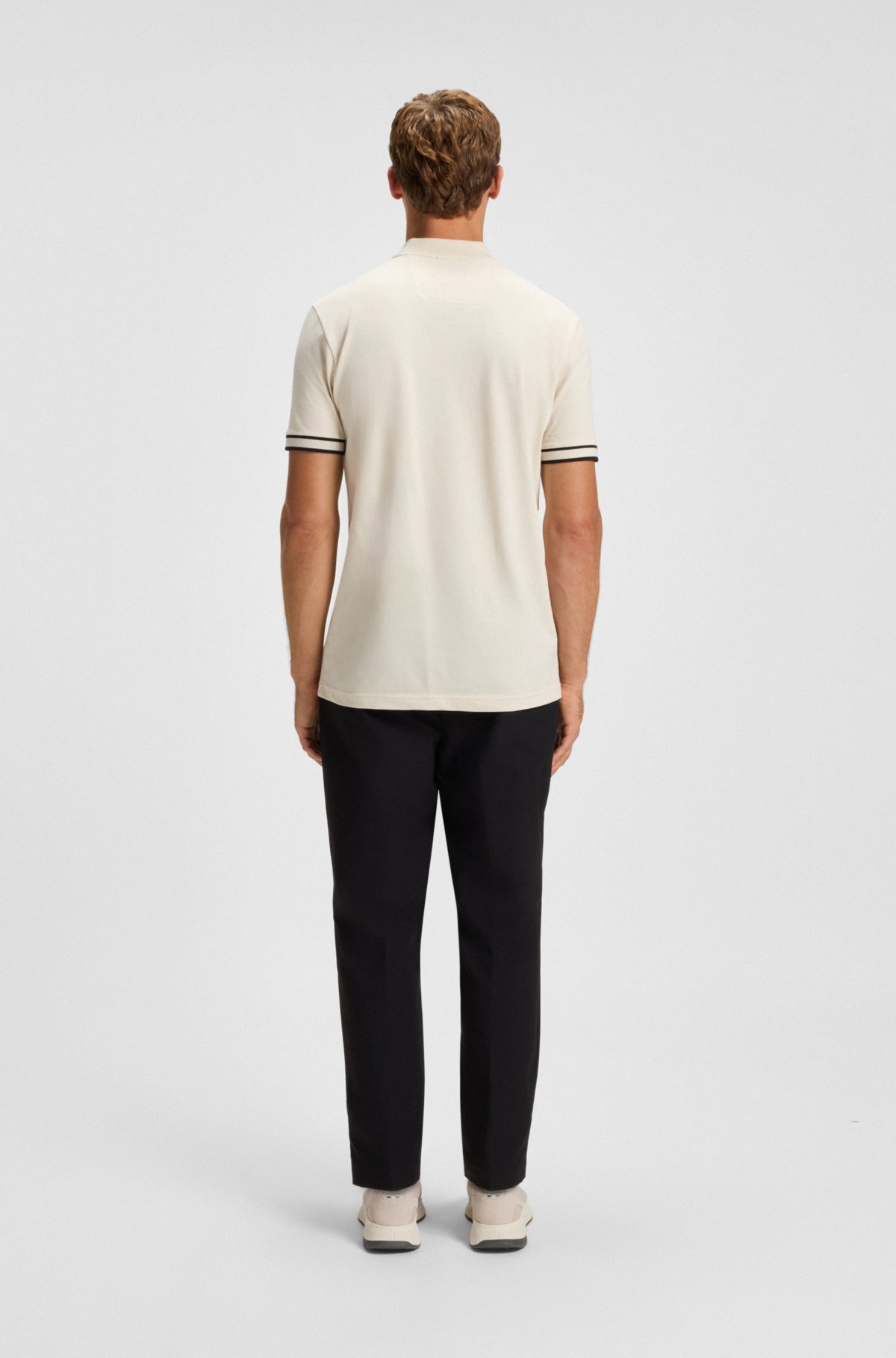 Camiseta polo con cuello de cremallera en piqué de algodón elástico