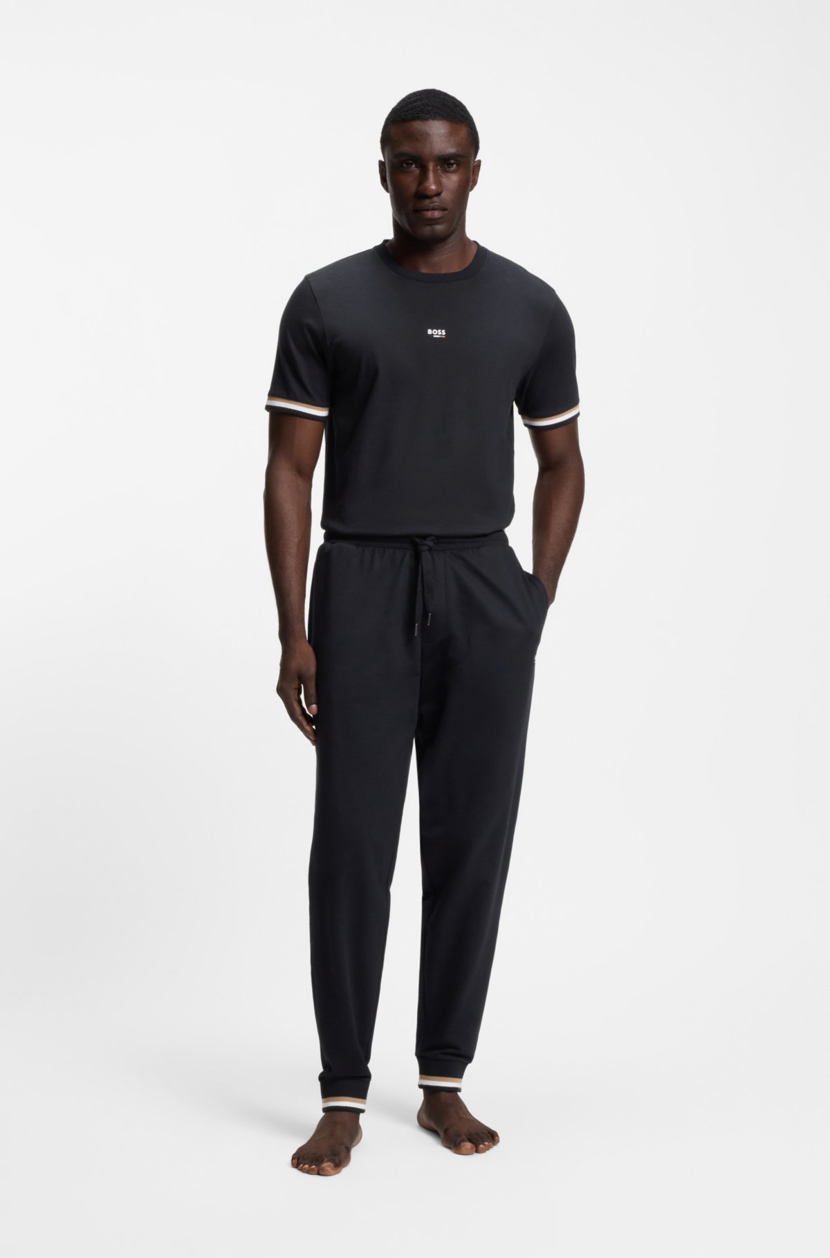 Pantalones de chándal de algodón-terciopelo con rayas características y logo
